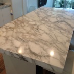 Carrara Marble Island Bench coated with Clearstone